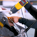 Professional applying window tint