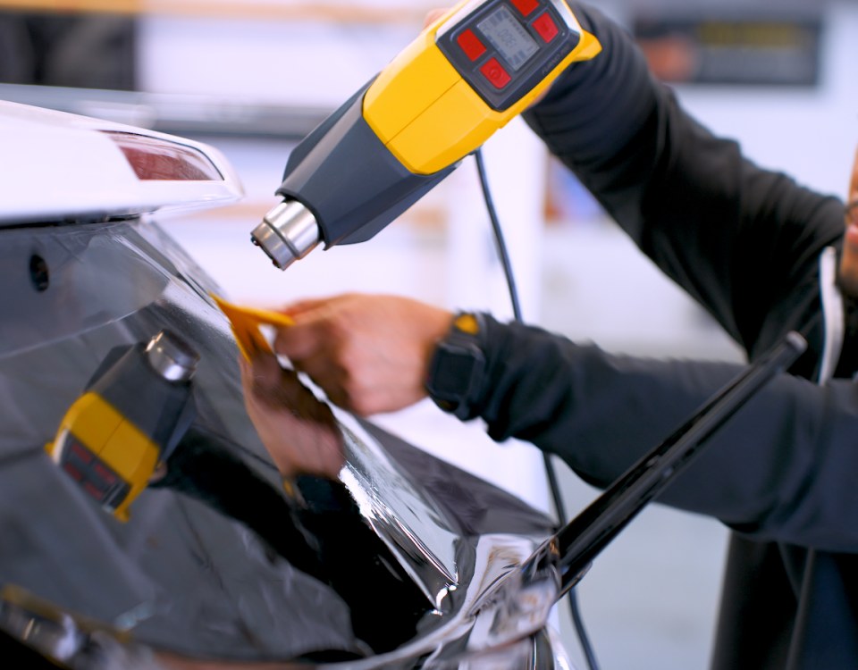 Professional applying window tint
