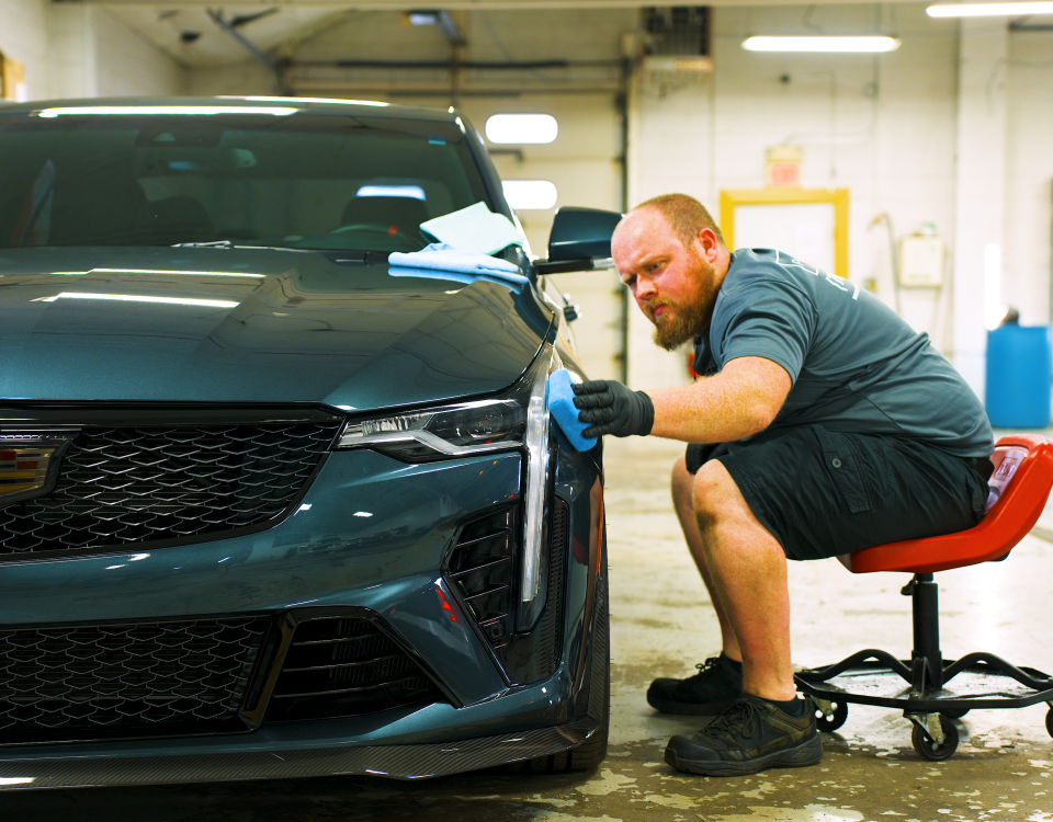 Premier team member applying a ceramic coating
