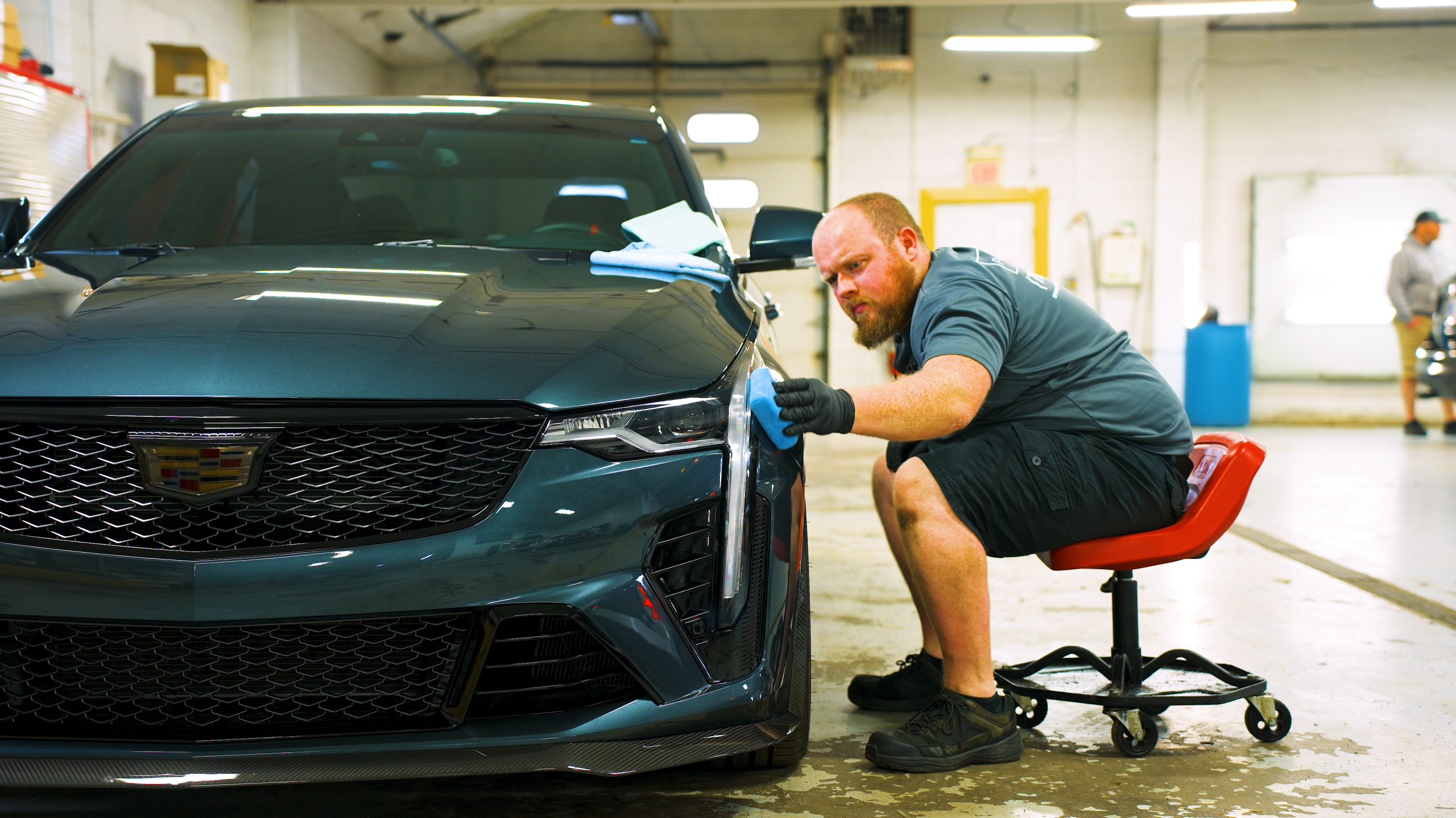 Premier team member applying a ceramic coating