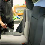 Professional applying interior ceramic coating.